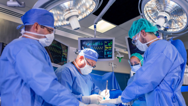 Group of surgeons performing surgery.