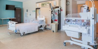BayCare's St Joseph's Hospital North NICU Couple Care showing a hospital bed next to a NICU bed