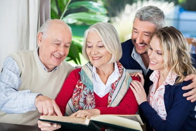 A senior couple is spending time with their daugther and son-in-law.