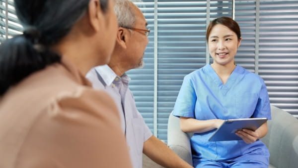 Asian nurse consulting with a patient in an office at BayCare Comprehensive Total Joint Center.