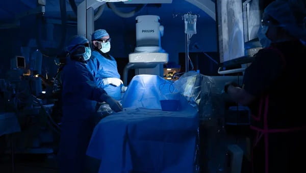 An image of two providers in the pediatric cardiac catheterization lab.
