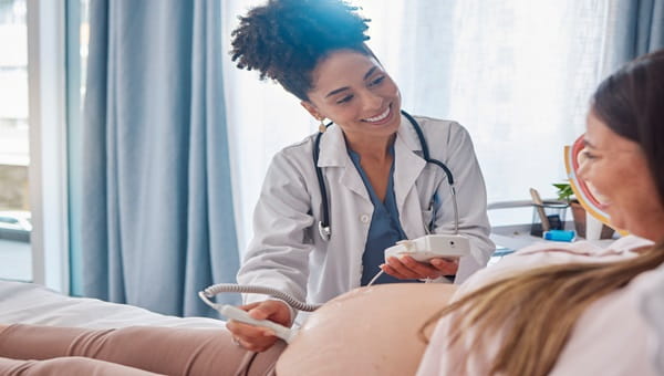 A doctor taking an ultrasound test of an unborn child
