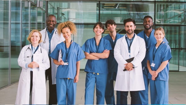 A group of doctors smiling at the camera