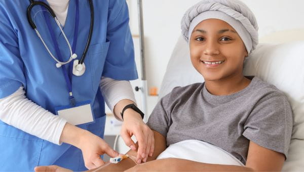 A pediatric cancer patient getting medicine in an IV. 