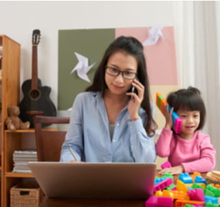 woman working at home with child