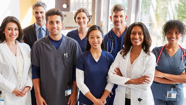 a group of doctors and health professionals smiling
