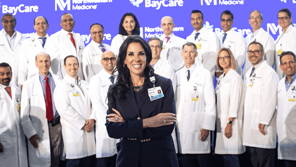 Image of BayCare CEO Stephanie Conners with doctors behind her